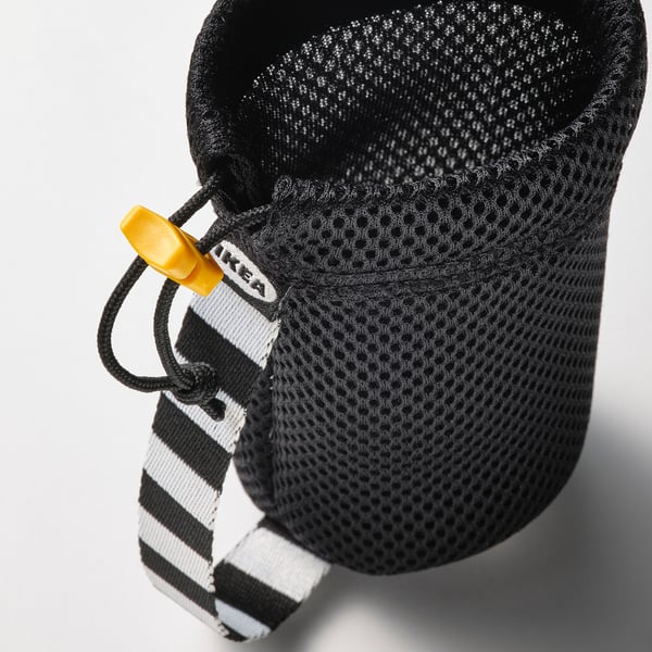 Black mesh bottle holder with drawstring and yellow stopper, branded IKEA for carrying sports bottles securely.