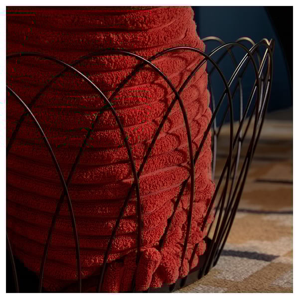 Red metal basket, intricate design, sturdy build for storage.