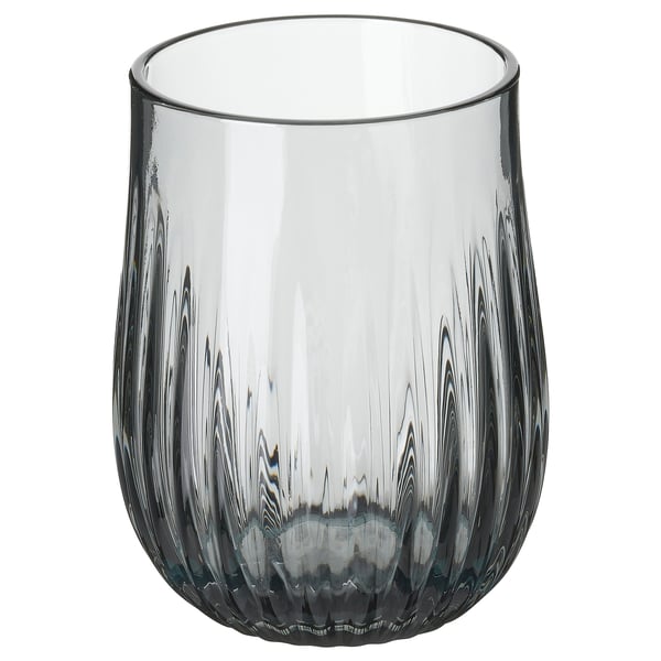 HÖSTAGILLE glass; grey, ribbed design, cylindrical shape. Glass material; elegant, textured surface.