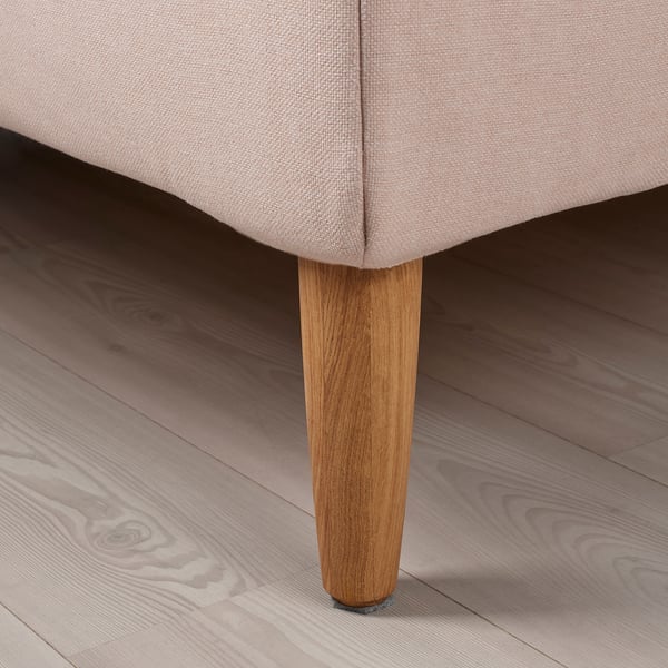 Upholstered bed with curved wooden legs, showcasing high-quality fabric and sturdy design.