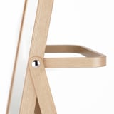 Modern wooden coat rack with angled support and metal fastener, part of IKORNNES series.