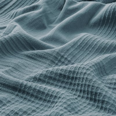 Blue cotton INDIRA bedspread, textured, folded, for double beds.