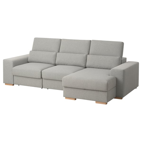 A grey ISTABY sectional sofa with a high back, adjustable headrests, and a chaise lounge. It is designed for comfort and relaxation.