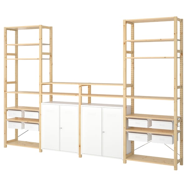 IVAR, a light wood modular storage system with white drawers and cabinets, ideal for organizing various spaces.