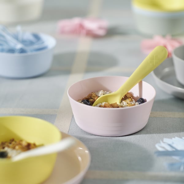 KALAS bowls in pink and pastel colors, made of durable plastic, round shape with a yellow spoon, small size, perfect for kids.