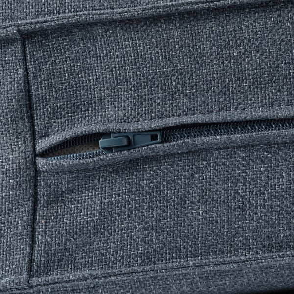 Close-up of durable, textured KIVIK sofa fabric, showcasing quality zipper detail.