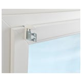 White window mount with metal brackets, securing blinds to window frame without drilling.