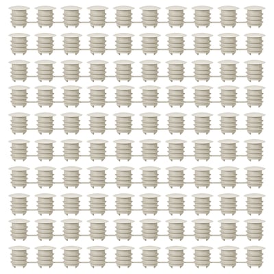 Grid of white KOMPLEMENT plastic furniture cover caps, uniformly shaped and aligned.