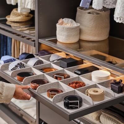 KOMPLEMENT grey organizer tray with multiple compartments for storing accessories and small items, made from durable materials.