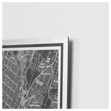 A sleek, metallic picture frame, KOPPARFALL, displays a black and white map with a 3d-like effect against a light wall.