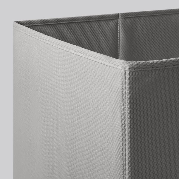 Close-up of durable, neatly stitched fabric storage box, showcasing quality craftsmanship and design.