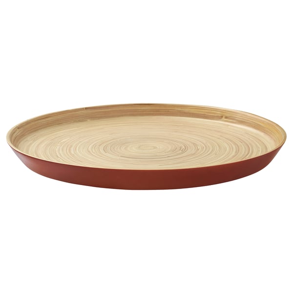 Circular bamboo serving tray with red edge & light wood grain pattern, elegant design.