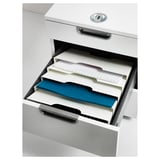 White file cabinet with open drawer, featuring blue and white file folders for organizing papers.