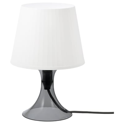 LAMPAN: modern portable white lamp with sleek silver base, plastic parts, cylindrical shade for cozy lighting.