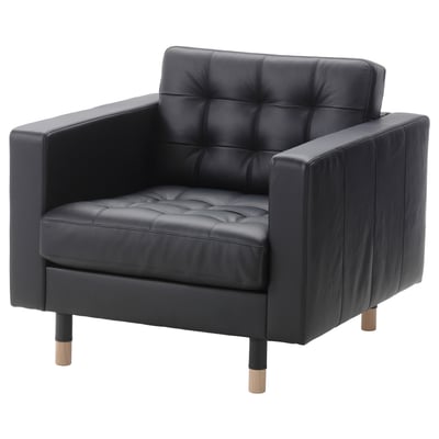 Black leather armchair with tufted seat, square back, and wooden legs.