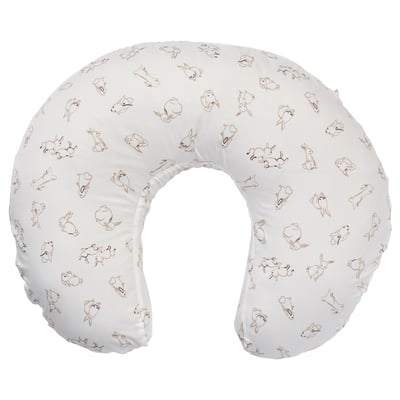 This image shows a white baby blanket with beige rabbit prints, featuring soft, sustainable cotton material.