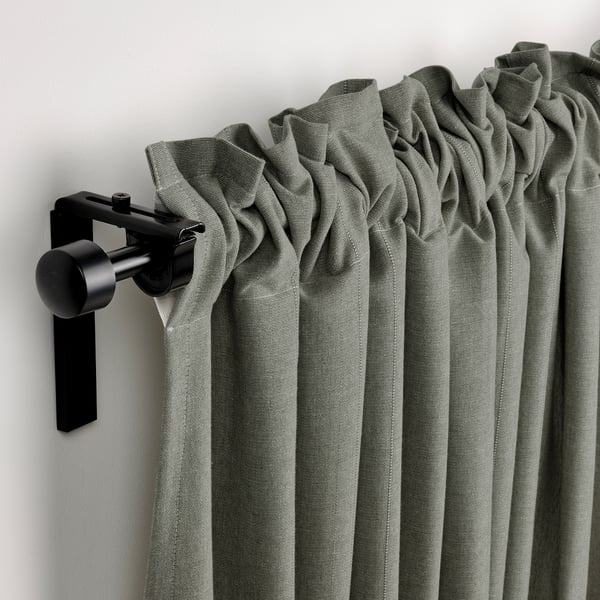 Modern curtain rod holding grey-green LENDA curtains with header tape, partially drawn back to show outside view.