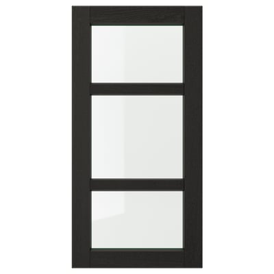 A black LERHYTTAN kitchen cabinet door with a solid wood frame and clear glass panels, showcasing a traditional design.