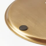 Sleek gold round tray with black felt pad, elegant and practical.