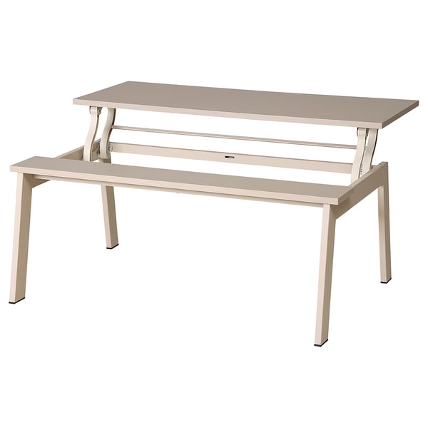 A LJUNGSBRO multi-functional table in beige. It a rectangular top, metal legs, and a lifting mechanism.