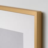Golden picture frame corner, sleek and thin, showcasing high-quality metal edge and clear plastic front.