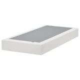 A white LYNGÖR flat-pack bed base with a removable, washable cover for easy cleaning. It flat slats for mattress support.