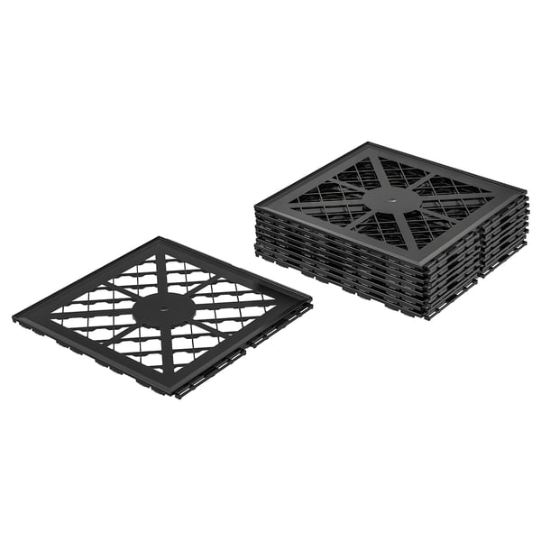 Two stacks of black, square, interlocking plastic tiles with diamond patterns.