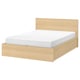 MALM light brown wooden bed with white mattress, classic rectangular shape, clean modern design.