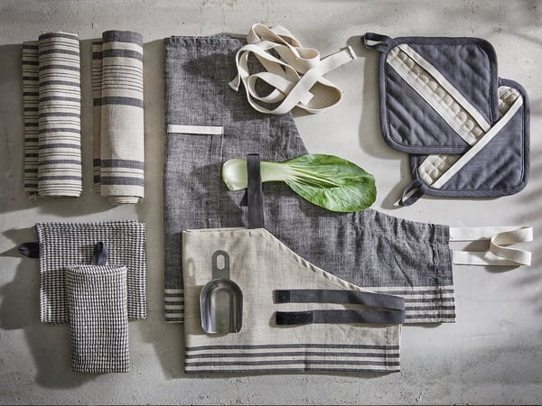 Kitchen textiles: MARIATHERES towels & mitts in stripes & checks, cotton & linen, on concrete.