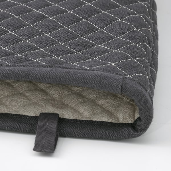 High-quality grey cushion with intricate quilted pattern, soft linen-cotton blend, and secure black strap for carrying.