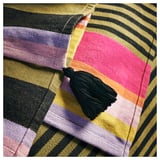 MÄVINN striped throw, multicolored with black tassels, handwoven cotton, soft and warm.