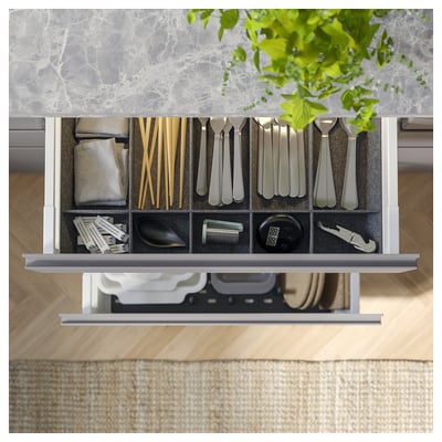 MAXIMERA white drawer unit with metal runners, sleek design.