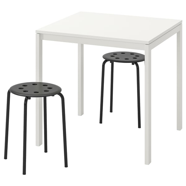 Image a white MELLTORP table and two black stools. Minimalist design, strong metal frames, suited for small spaces.