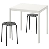 Image a white MELLTORP table and two black stools. Minimalist design, strong metal frames, suited for small spaces.