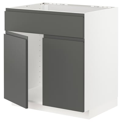 Modern grey kitchen unit with sleek, dark panels and white framework.