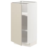 A white METOD kitchen cabinet with a beige door, adjustable shelves, and a sleek modern design.