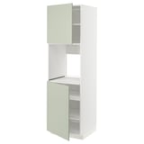 A METOD kitchen cabinet with stensund green doors, showcasing a vertical design with adjustable shelves and a 25-year guarantee.