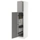 A white METOD kitchen cabinet with grey bodbyn doors, featuring pull-out organizers and sturdy frame construction.