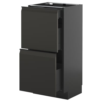 Modern black kitchen cabinet with two drawers and sleek, integrated handles.
