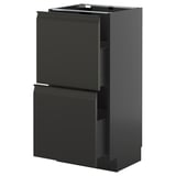 Modern black kitchen cabinet unit with integrated handles, sleek design, and smooth drawers.