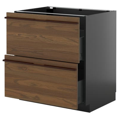 Dark brown stained ash drawer unit with wooden handles, set in modern kitchen.