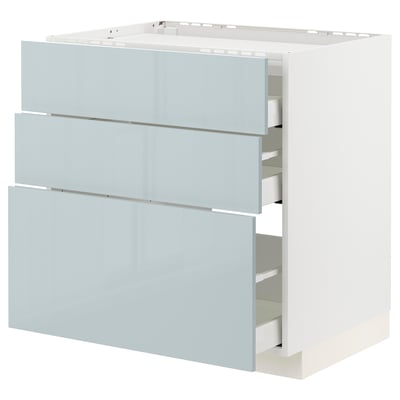 Modern light grey-blue kitchen cabinet with three drawers, minimalist design, high gloss finish.