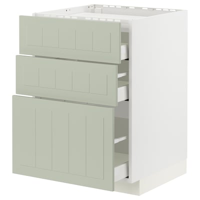 A modern white-framed METOD kitchen unit with three green drawers and a cabinet.