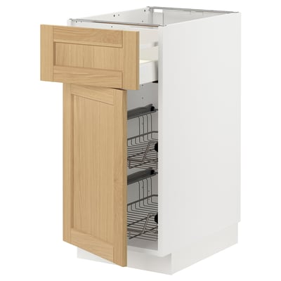 A white METOD kitchen cabinet with a light oak veneer door and pull-out wire basket.