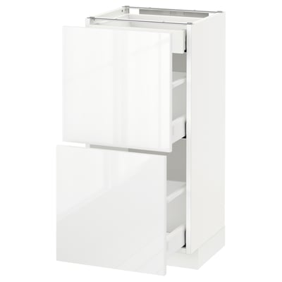 A white METOD kitchen cabinet with high gloss finish and double drawers.