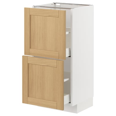 METOD kitchen unit with oak drawers and white base.