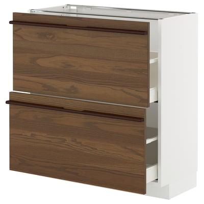 METOD dark brown kitchen cabinet with wooden drawers and white frame.
