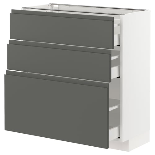 A modern, white METOD kitchen cabinet with three grey drawers, featuring integrated handles and a sleek design.
