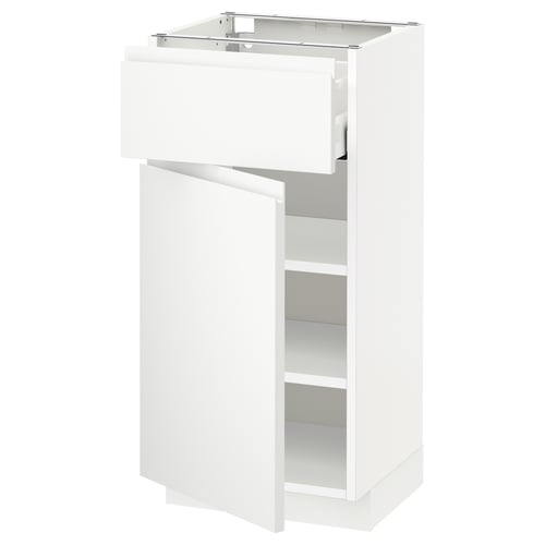 White METOD kitchen unit with open drawer and shelf.
