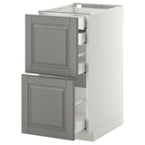 Modern kitchen unit, white with grey drawers, traditional style.